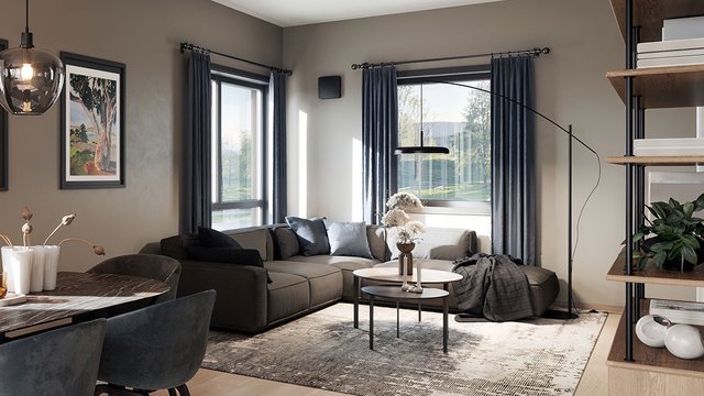 The image shows a room ventilator discreetly wall-mounted in a modern living room. The solution supports continuous ventilation and a healthy indoor climate without impacting the overall interior design.