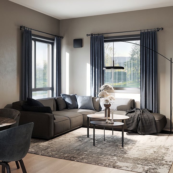 Stue med åpen planløsning der romventilator er diskret integrert i vegg